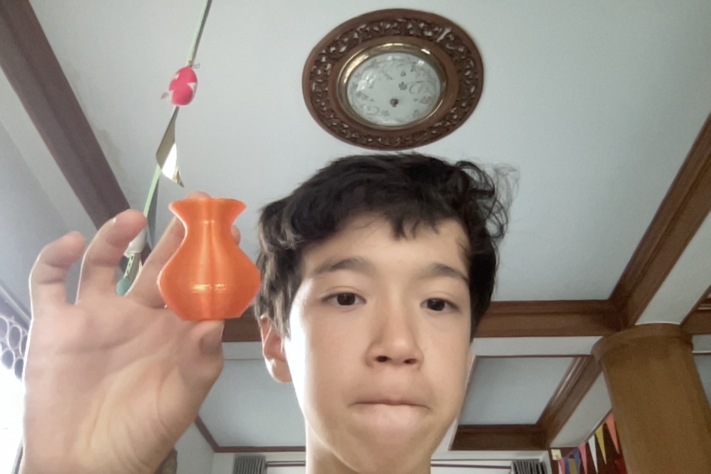 Miles holding the 3D printed pot for Mothers Day 2026