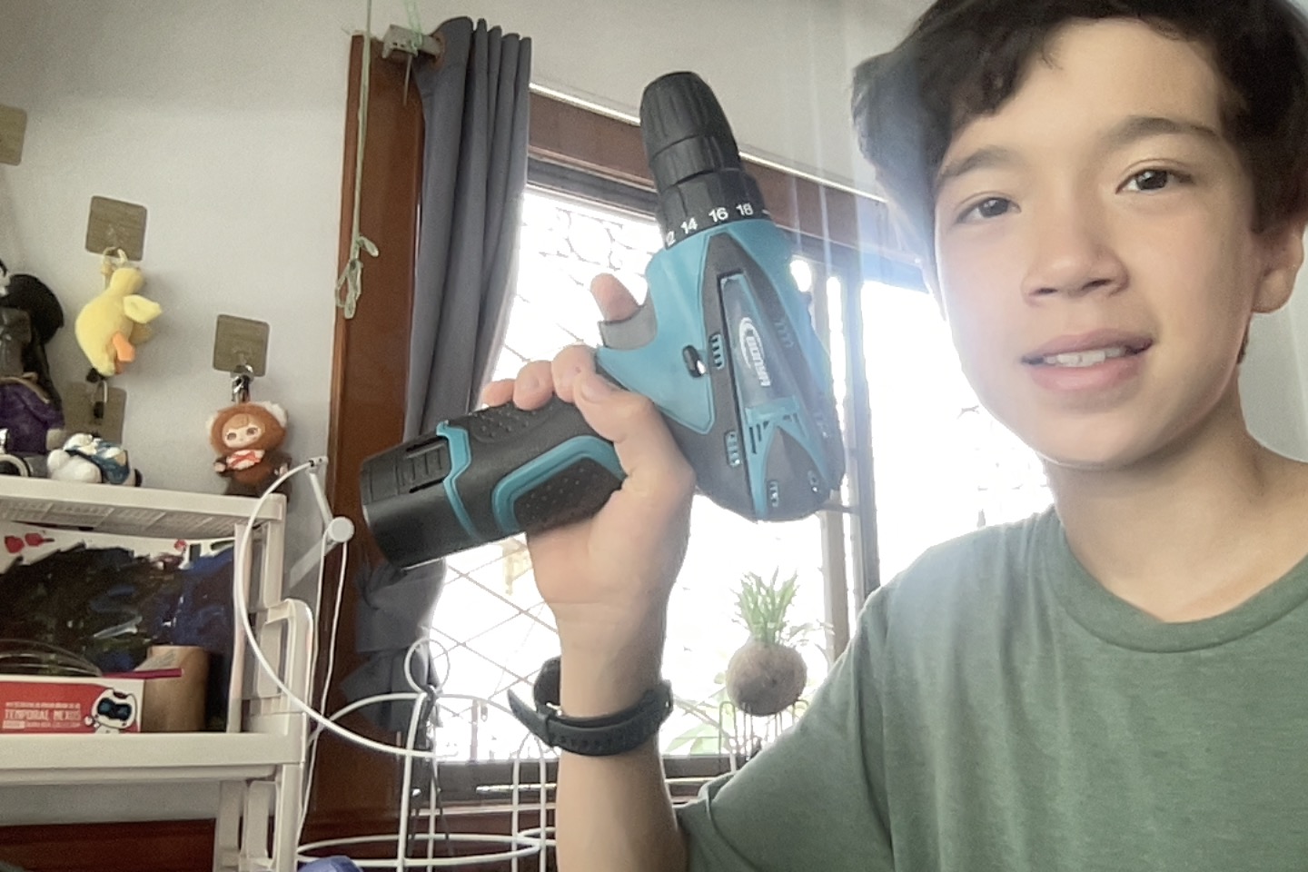 Miles holding his first drill