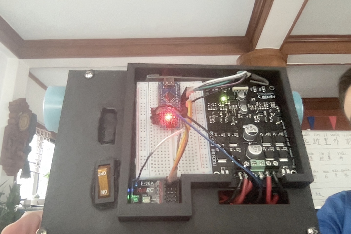 The open Version 2 robot showing the Arduino, receiver and Cytron motor driver